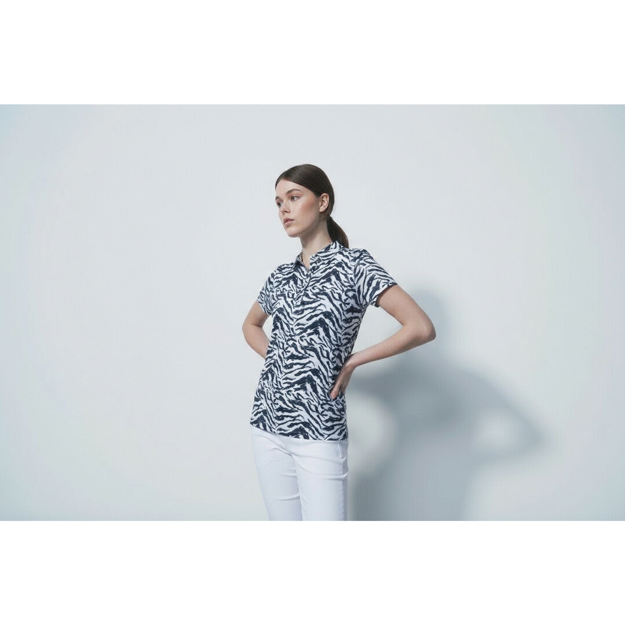 Polo da donna in mesh stampato con lenti QuickDry per lo sport quotidiano